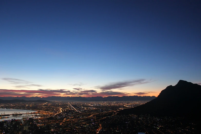 a view of a city at night from a high viewpoint