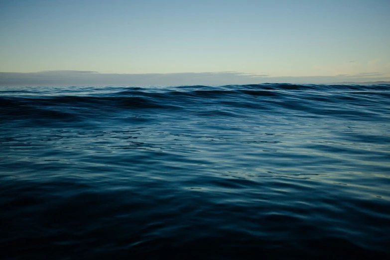 the sky above the water is partially cloudy