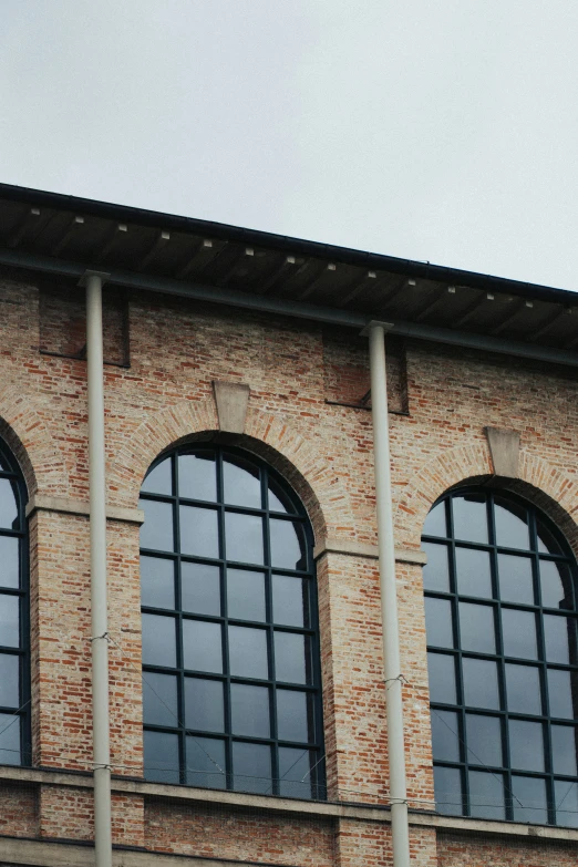 the view of an airplane flies over a building