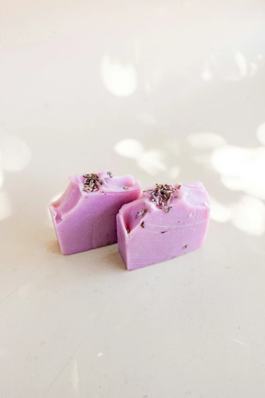 some kind of pink bar of soap with tiny diamond designs on it
