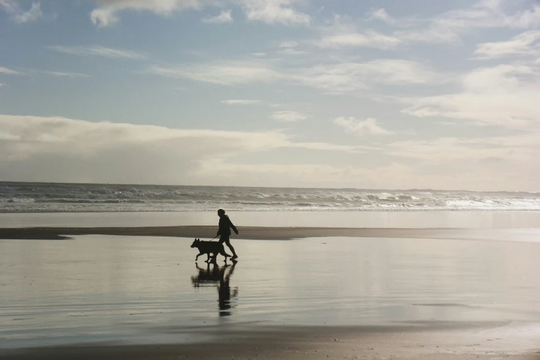 a person riding a bicycle near the ocean