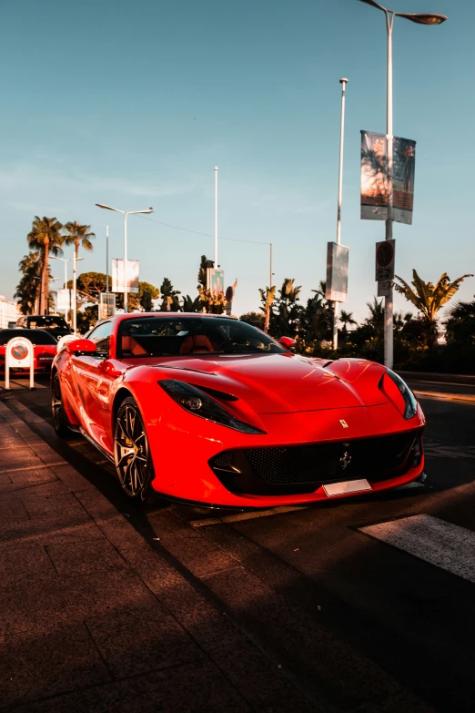 red sports car parked in a parking space