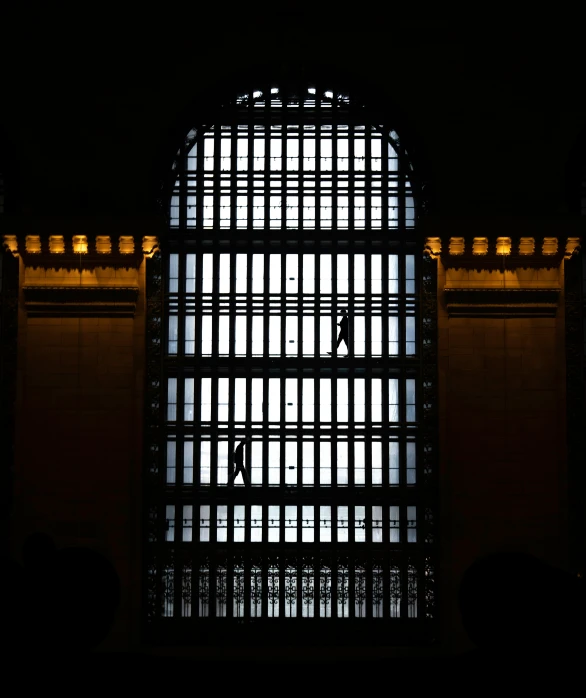 a window is shown with bars on it in the dark