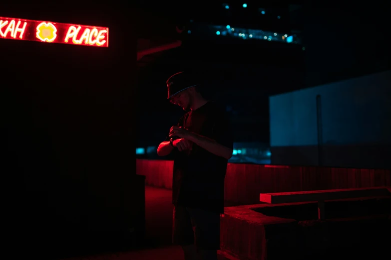 a person standing in a dark area with signs