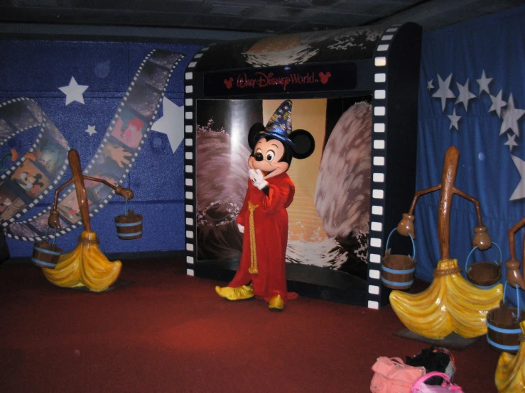 an exhibit featuring goofy mouse and his costumes