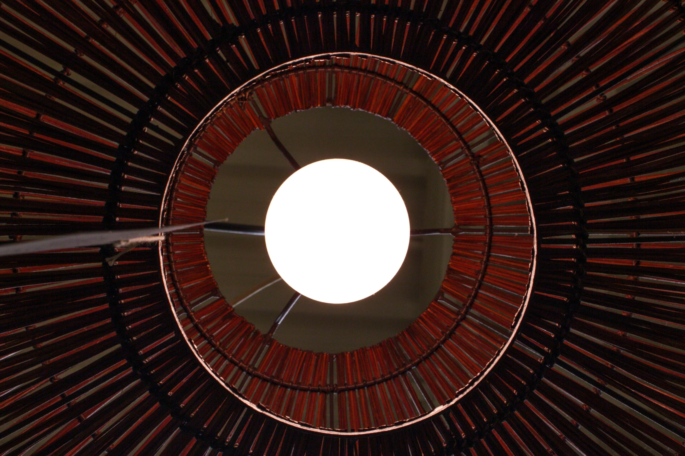 an inverted view looking up into the center of a wood structure