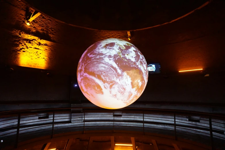a large projection of the earth in a building
