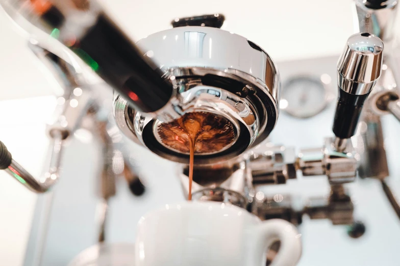 espresso machine making a cup of coffee and liquid