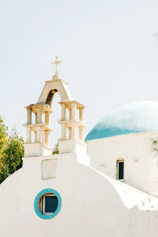 a white church with a blue dome