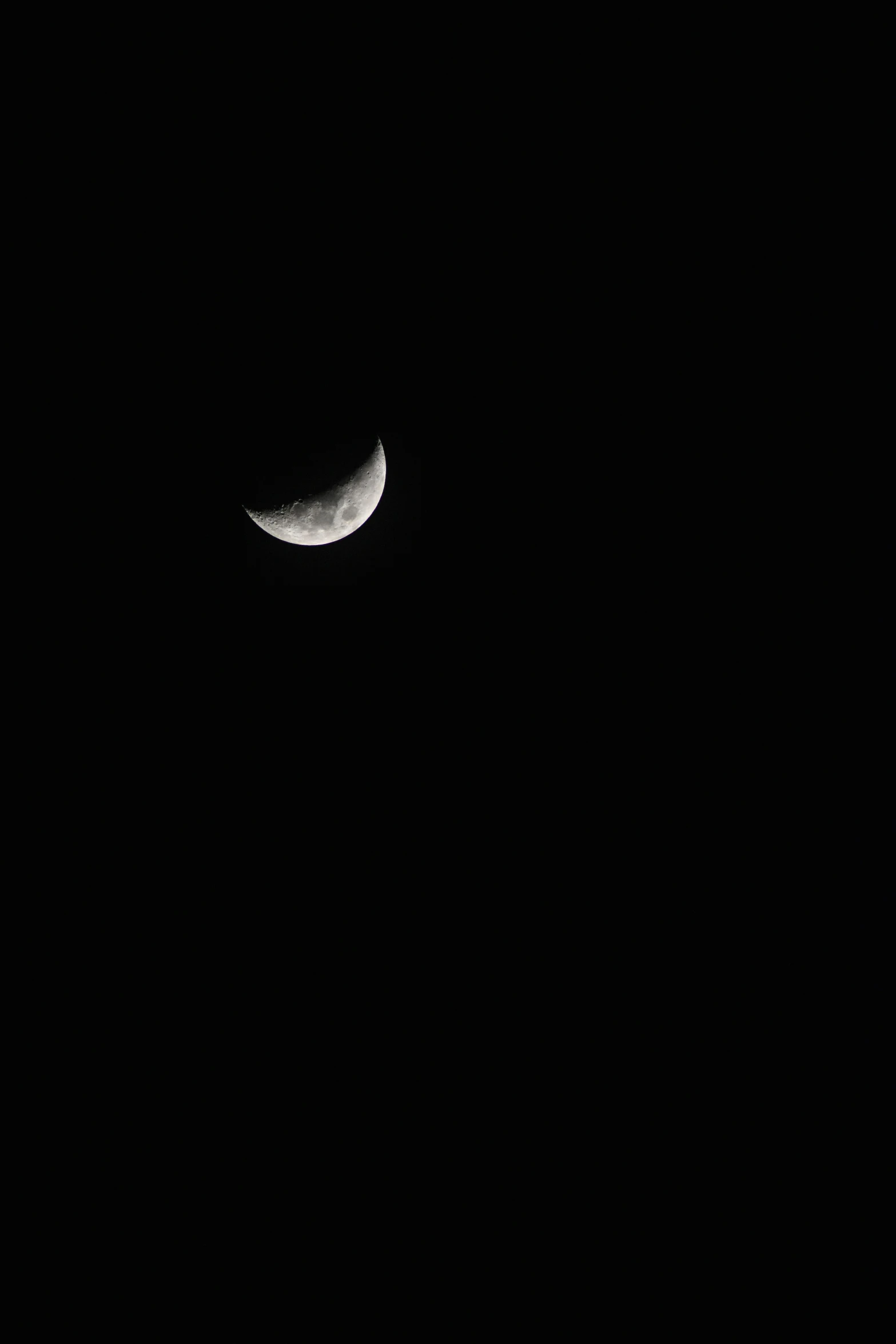 the moon that has been partially visible in a black sky