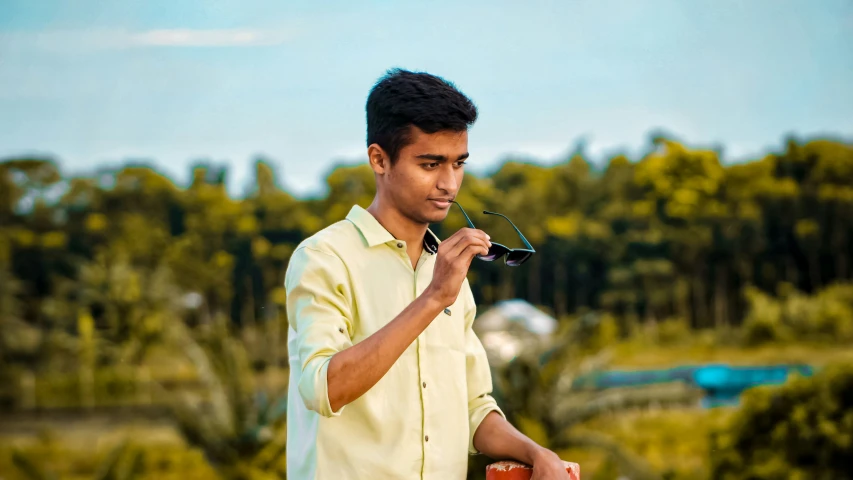 a man is holding an airplane and a can