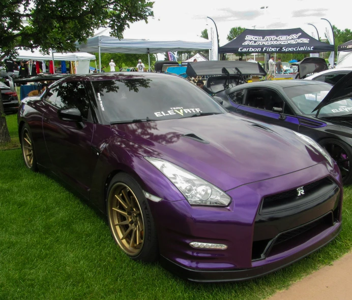 some very nice looking cars parked together