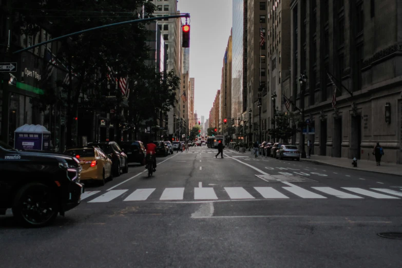 a picture of a city street with cars