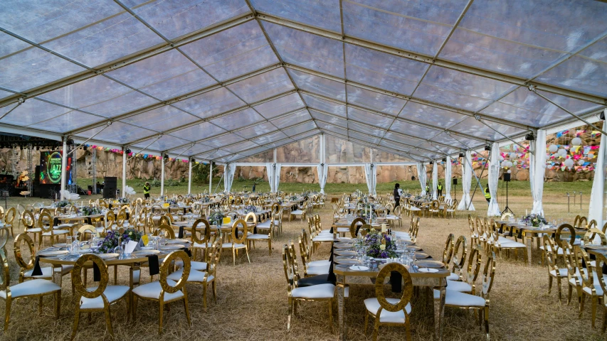 an open pavilion is set up for a wedding reception