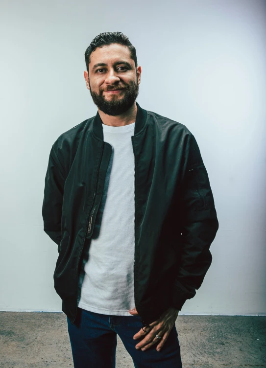 a man that is smiling with a beard