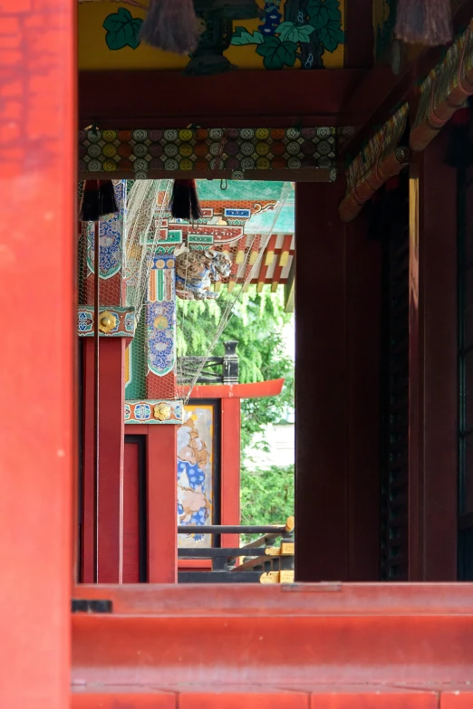 a colorful building with red wall and stairs