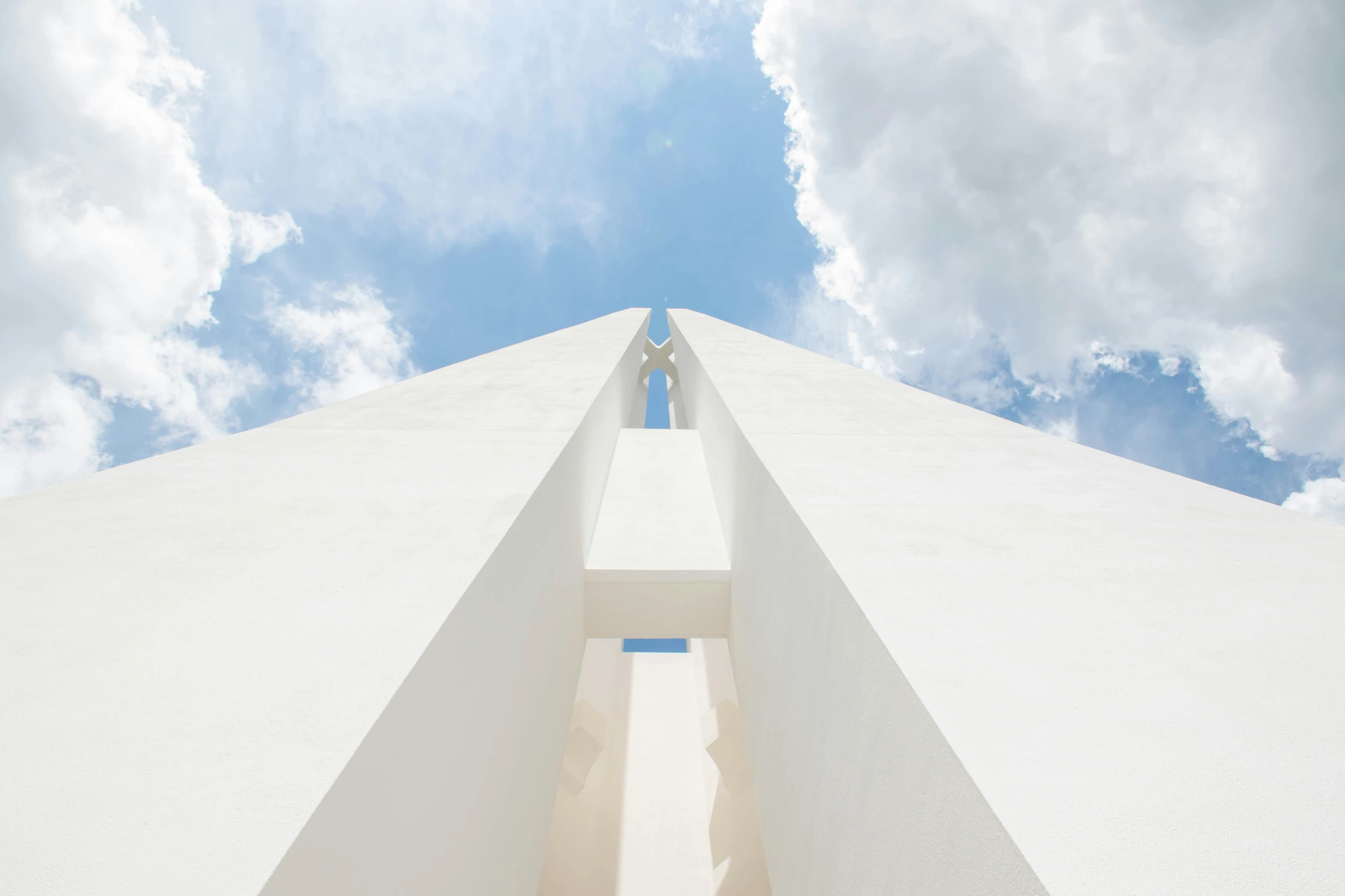 a person on a surfboard going up the side of a tall building