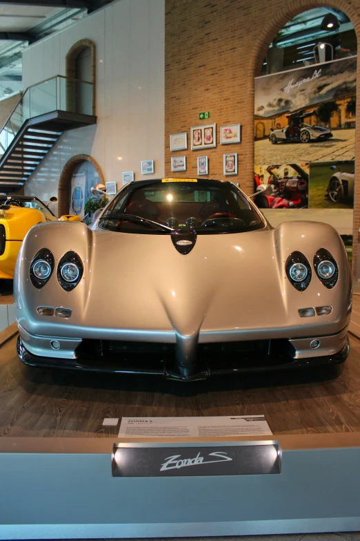 the front end of a car sitting in a room