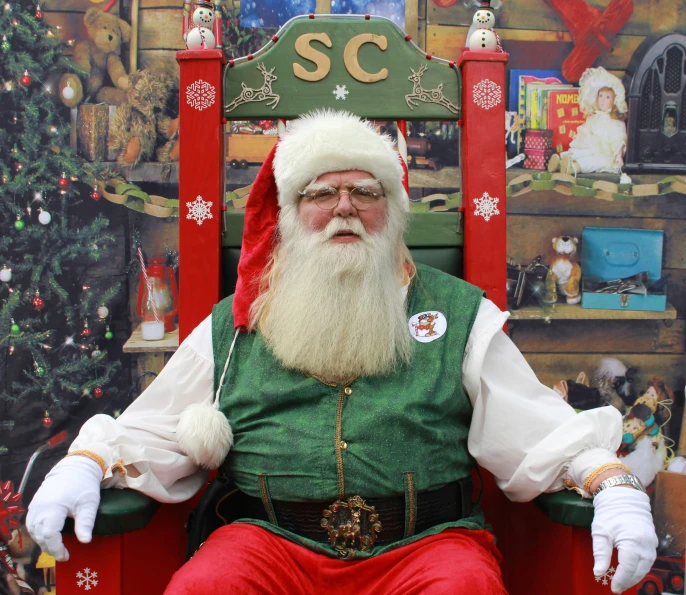 a christmas themed man in green and red outfit