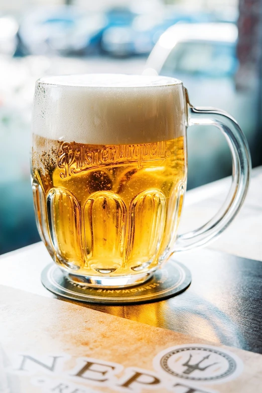 a mug of beer is sitting on a table