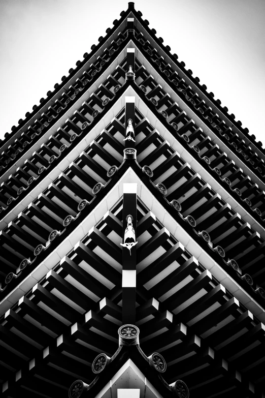 an architectural structure in black and white with a sky background