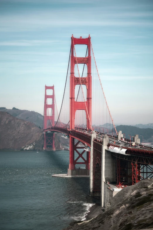 a red bridge with some water underneath it