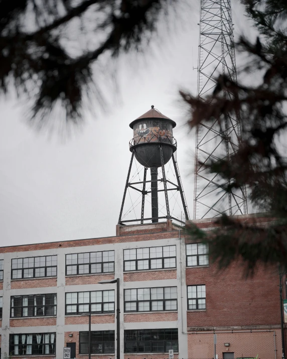 a very tall building with a big water tower on top