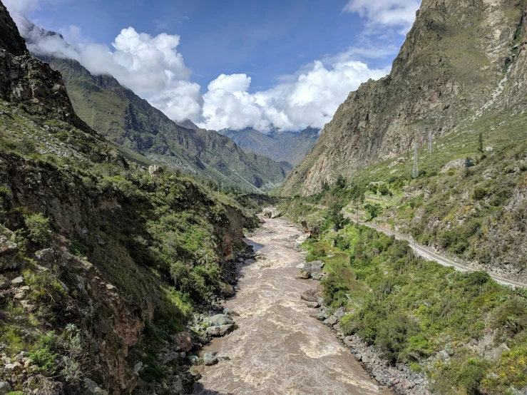 the river runs through the mountainous terrain near mountains