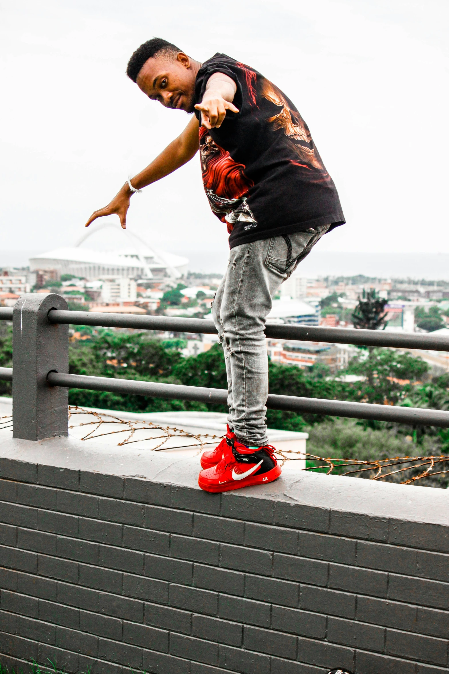 the young man has his arm outstretched as he rides a skateboard