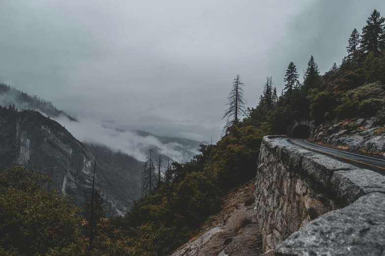 foggy mountains and a train traveling down them