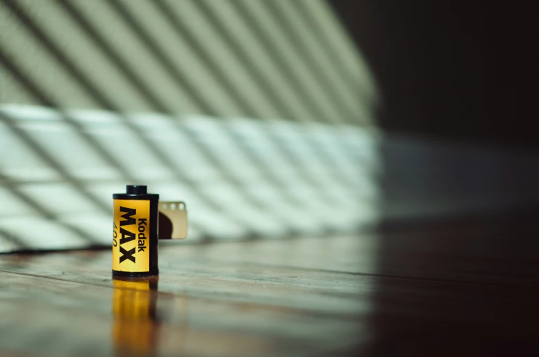 a mini lighter with a lego man logo on it