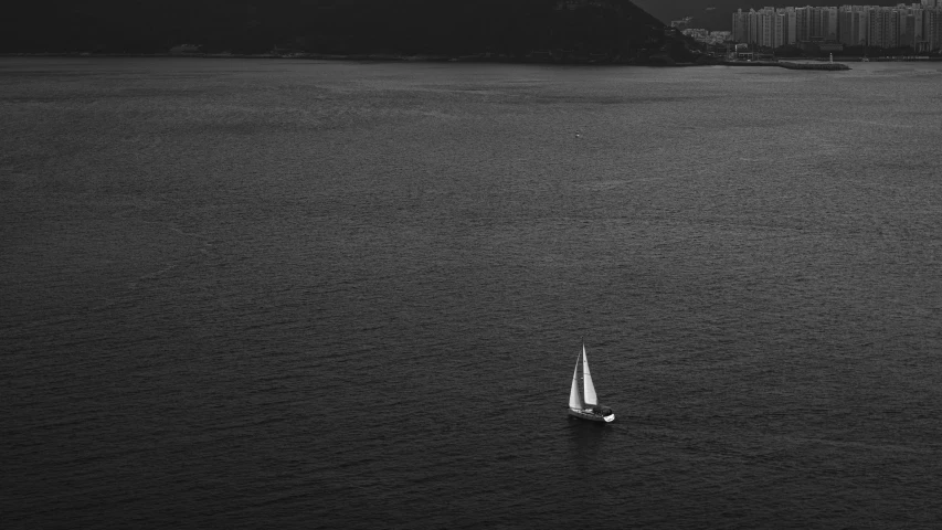 a small boat in a large body of water