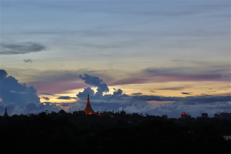 a large building with some spires in the sky