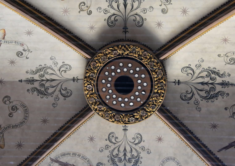 an artistically designed ceiling is featured in this image