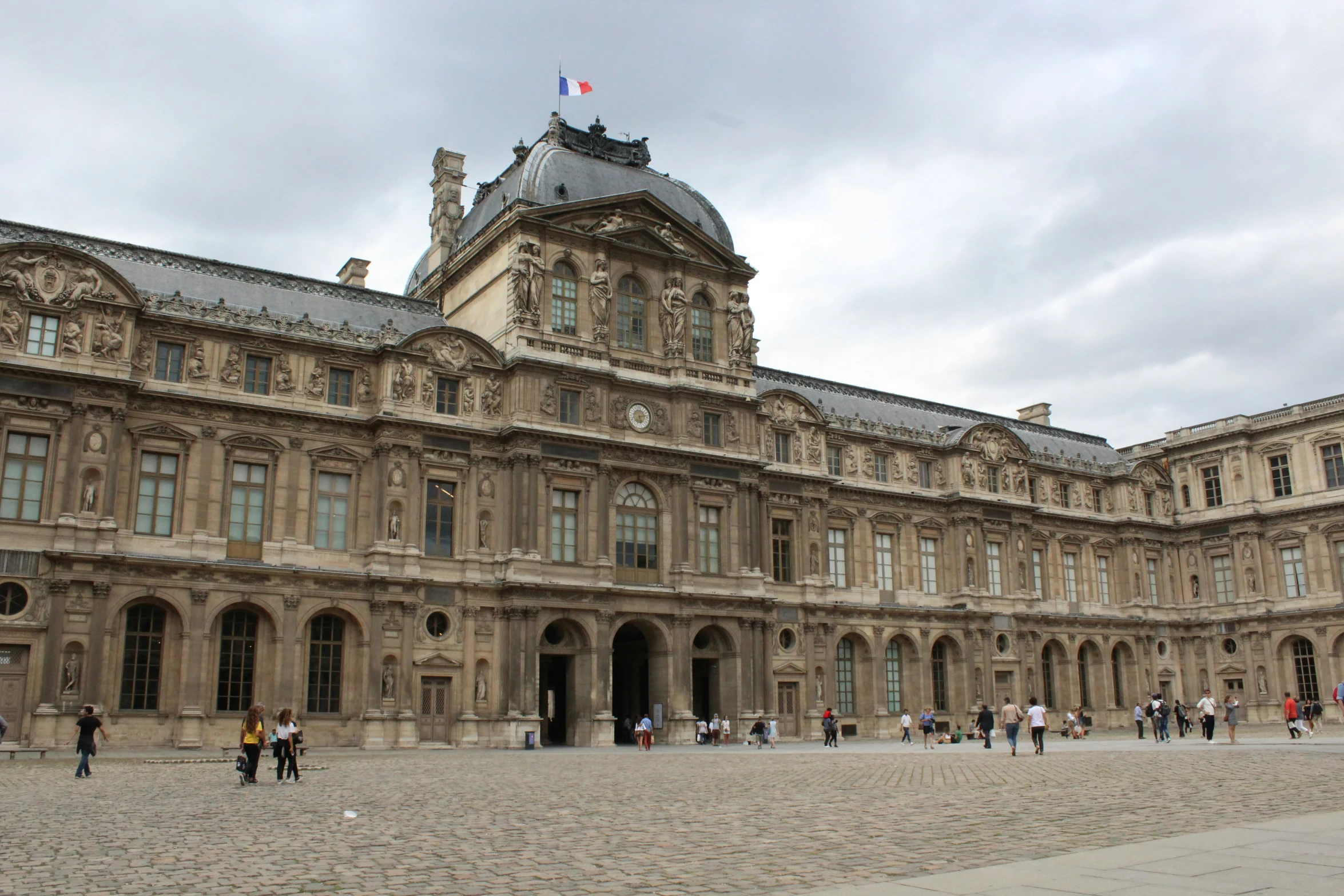 this is an image of a large building with people walking around