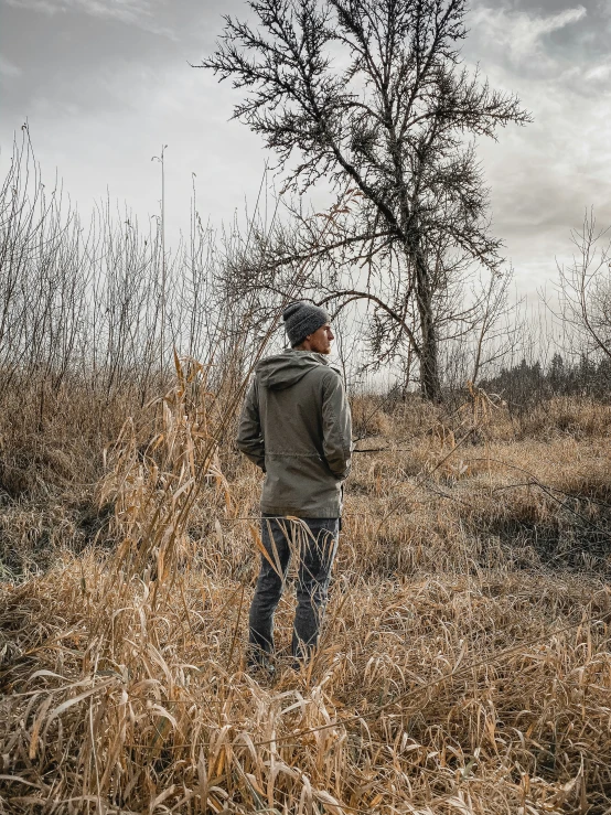 there is a person standing alone in a field