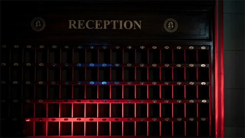 a red bench sitting next to a metal wall