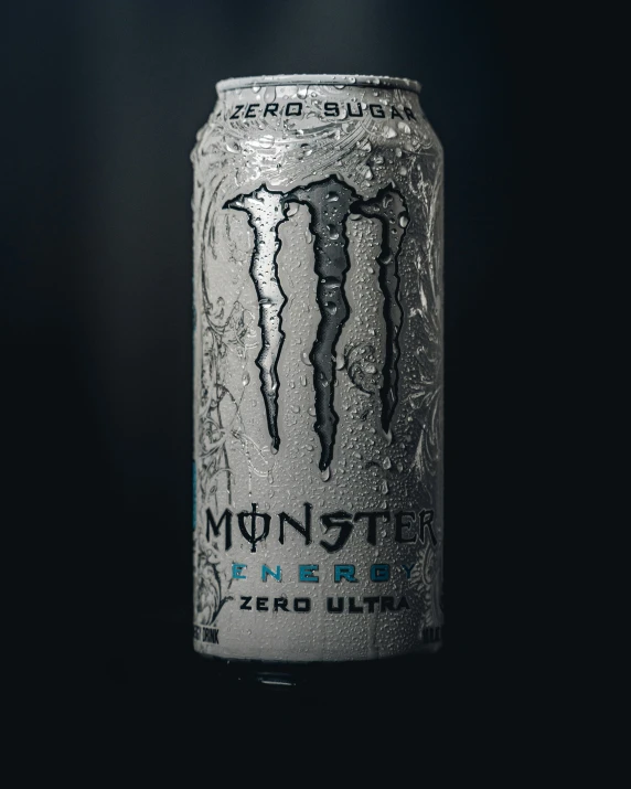 a close up of a can of beer with the logo monster energy