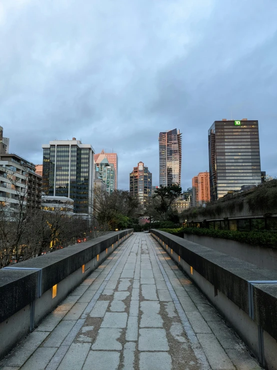 an empty city bridge with building near by