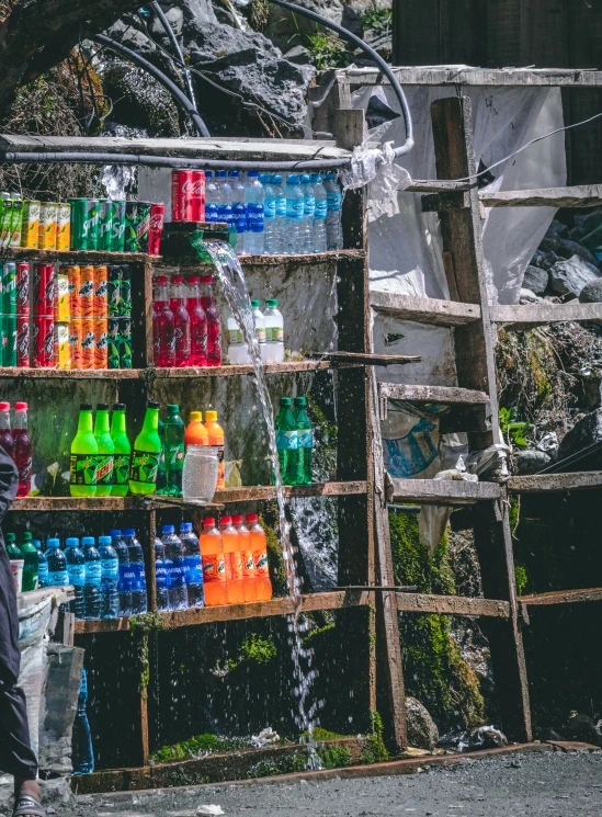 a large display of different colors and liquids