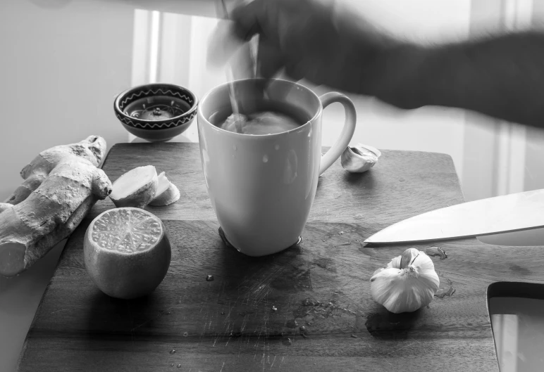 a knife is being used to cut up garlic on a kitchen counter