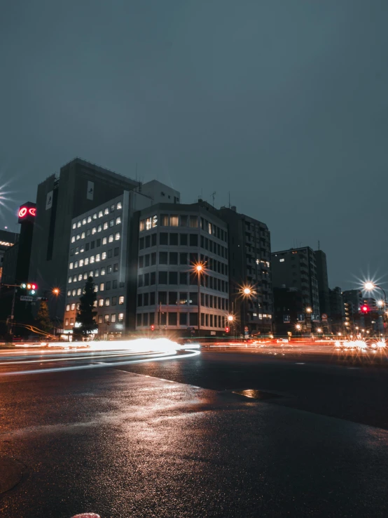 light shining from buildings in a very busy city