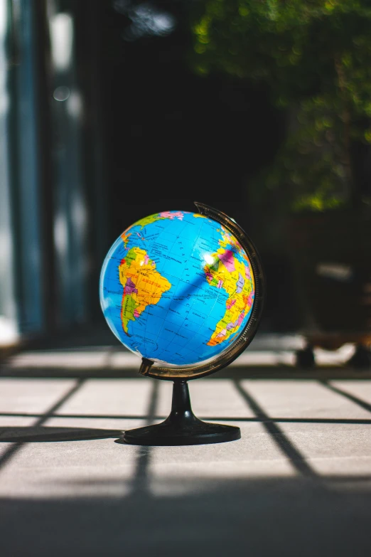 a small globe sits on top of a small table