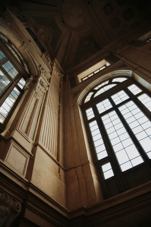 looking up at a domed ceiling with three windows