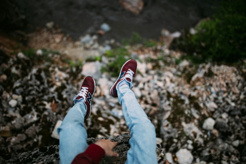 a person standing on some rocks on a sunny day