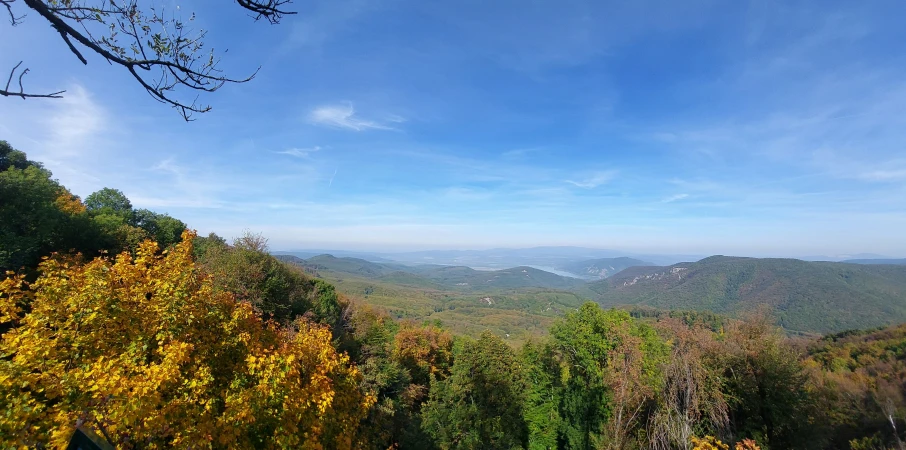 a view of a landscape from high on a hill