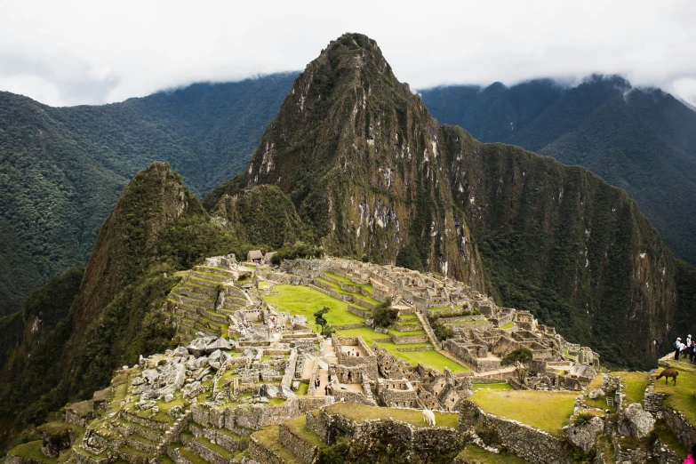 a mountain that is surrounded by ruins