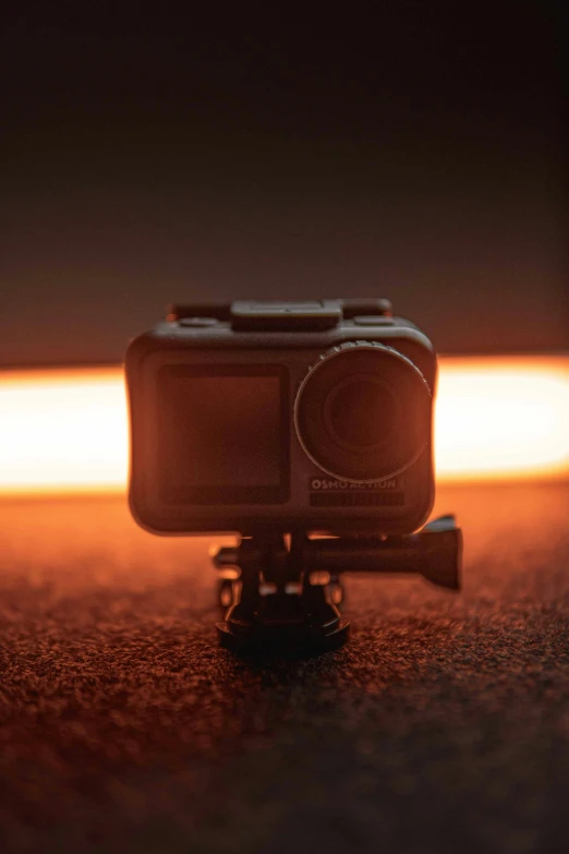 a brown colored po camera on a wooden table