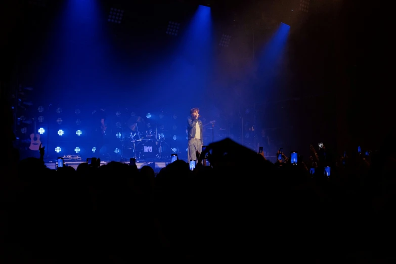 a large group of people on stage at a concert