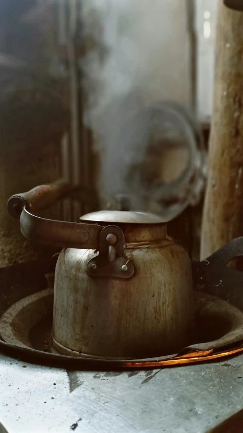 a kettle is sitting on the stove in the kitchen